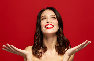 Image showing beautiful smiling young woman with red lipstick