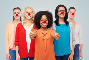 Image showing group of women showing thumbs up at red nose day