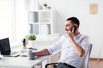 Image showing businessman calling on smartphone at office