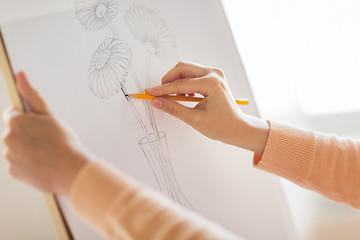 Image showing artist with pencil drawing picture at art studio