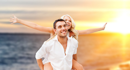 Image showing happy couple over sea background