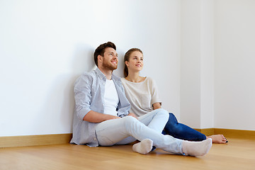 Image showing happy couple at empty room of new home