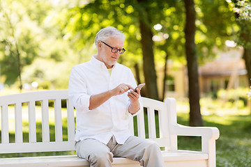 Image showing senior man with smartphone at summer park