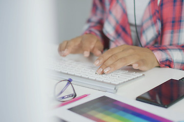 Image showing Crop worker using keyboard