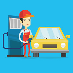 Image showing Worker filling up fuel into car at the gas station