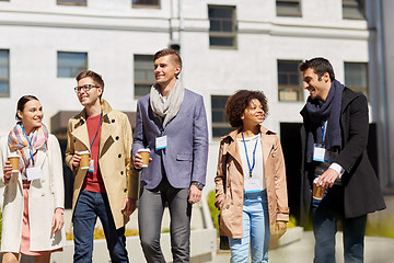 Image showing office workers with coffee on city street