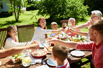 Image showing happy family having dinner or summer garden party