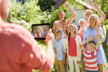 Image showing happy family photographing by tablet pc in summer