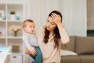 Image showing tired mother with baby boy at home