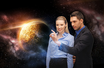 Image showing businessman and businesswoman over space