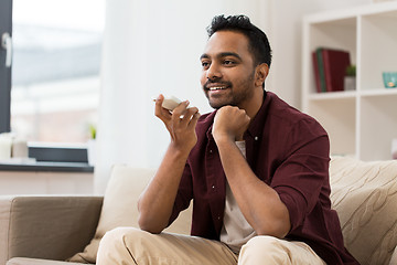 Image showing man using voice command recorder on smartphone