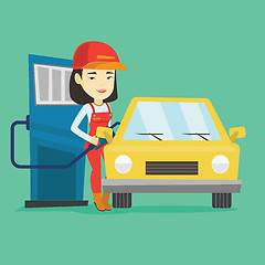 Image showing Worker filling up fuel into car at the gas station