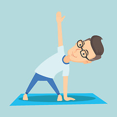 Image showing Man practicing yoga triangle pose.