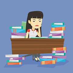 Image showing Student sitting at the table with piles of books.