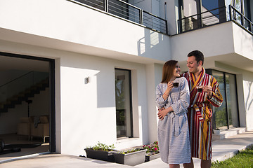 Image showing Young beautiful couple in bathrobes