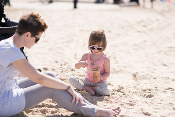 Image showing Mom and daughter on the beach