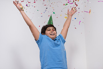 Image showing kid blowing confetti