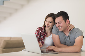 Image showing happy young couple buying online