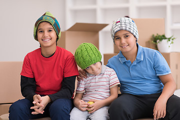 Image showing boys with cardboard boxes around them