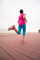 Image showing woman busy running on the promenade