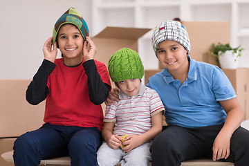 Image showing boys with cardboard boxes around them