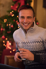 Image showing Happy young man with a glass of champagne