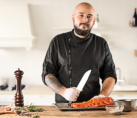 Image showing Man cooking meat steak on kitchen