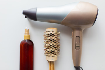 Image showing hairdryer, brush and hot styling hair spray