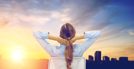 Image showing businesswoman sitting on chair from back