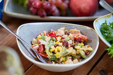 Image showing smoked chicken salad in bowl on wooden table