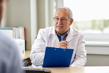 Image showing senior doctor talking to male patient at hospital