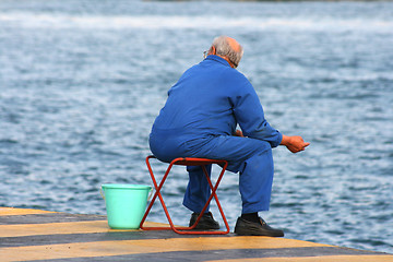 Image showing senior man fishing
