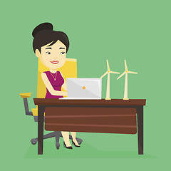 Image showing Woman working with model of wind turbines.