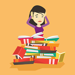 Image showing Student sitting in huge pile of books.