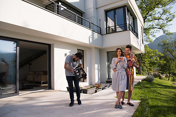 Image showing Young beautiful couple in bathrobes