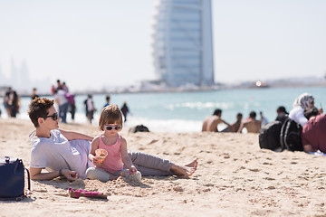 Image showing Mom and daughter on the beach