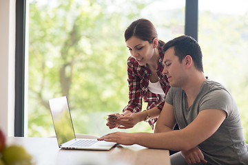 Image showing happy young couple buying online