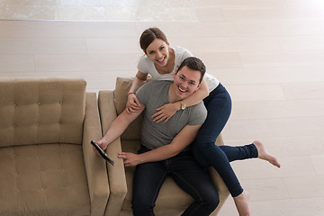 Image showing couple relaxing at  home with tablet computers