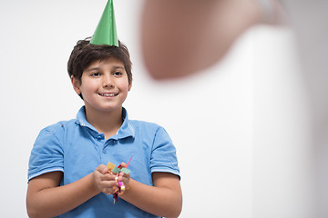 Image showing kid blowing confetti