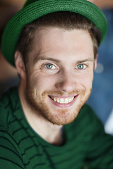 Image showing portrait of happy young man in green hipster hat