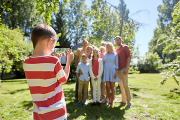 Image showing happy family photographing by tablet pc in summer