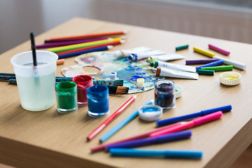 Image showing palette, brushes and paint tubes on table