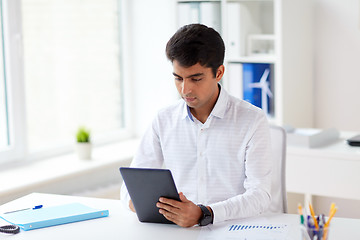 Image showing businessman working with tablet pc at office