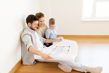 Image showing happy family with blueprint moving to new home