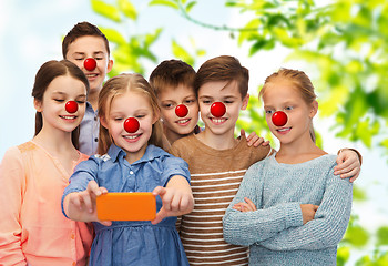 Image showing kids taking selfie with smartphone at red nose day