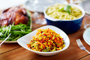 Image showing vegetable salad with corn and other food on table