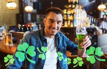 Image showing man drinking green beer at bar or pub