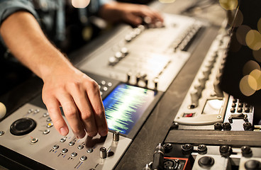 Image showing man using mixing console in music recording studio