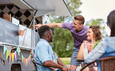 Image showing happy customers or friends at food truck