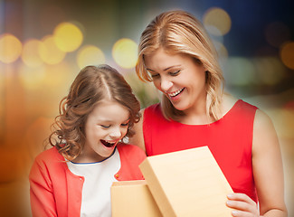 Image showing happy mother and daughter with gift box